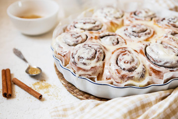 Cinnabon buns. Sinabon rolls with cream cheese and cream, chocolate and brown sugar