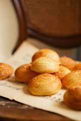 Homemade profiteroles on the music sheet with notes. Profiteroles (choux à la crème) - French choux pastry balls filled with custard or cottage cheese