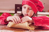  Dough home cuisine. Portrait of little beautiful child girl chef.