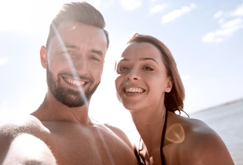 Fototapeta premium Happy couple spending carefree time on the beach outdoors.