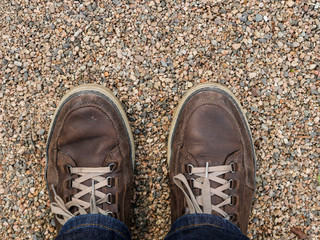 Shoes standing on gravel