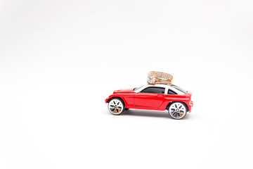 Fototapeta na wymiar Red toy car, golden ring, marriage proposal, happiness concept