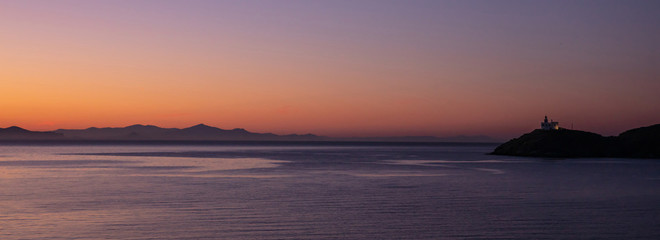 Naklejka na ściany i meble Greece, Kea island. Seascape with lighthouse at sunset, banner
