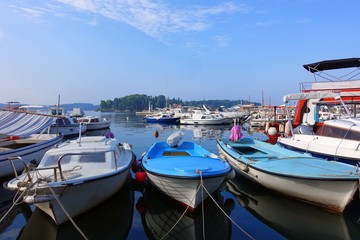 Fototapeta na wymiar Colorful fishing boats in the harbor in Rovinj, Croatia