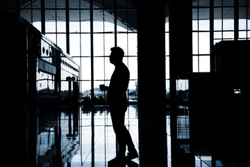 An anonymous men looking for information screen in an airport
