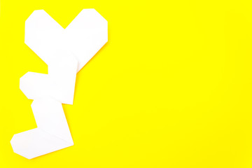 Fototapeta premium valentine's day card, origami heart, it is yellow. Copy space