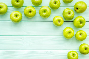 summer fruit pattern with apples on light wooden background top view copyspace