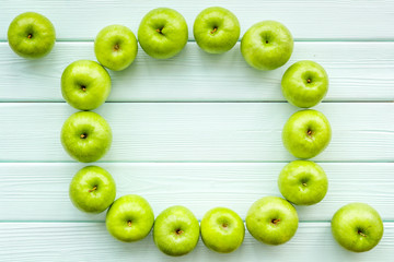 food pattern with green apples on light wooden background top view space for text