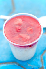 Tapioca pudding milk dessert with strawberry jelly