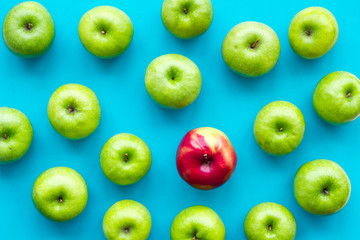 summer food with apples on blue background top view pattern