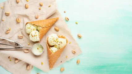 Ice cream with pistachios on a light background, with space. Summer mood