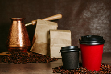 Paper cup with coffee on a wooden surface