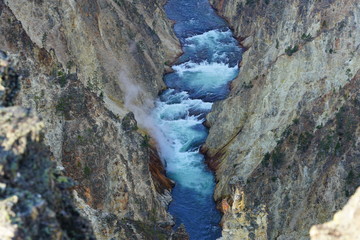 View of the Lower Falls waterfall and the Yellowstone River from the Artist Point lookout in Yellowstone National Park, Wyoming