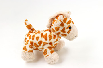 Little giraffe plushie isolated on white background with shadow reflection