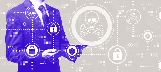 Virus and scam theme with businessman holding a tablet computer