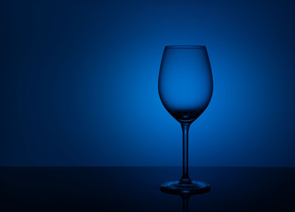 Clear drinking glass isolated on cyan blue background
