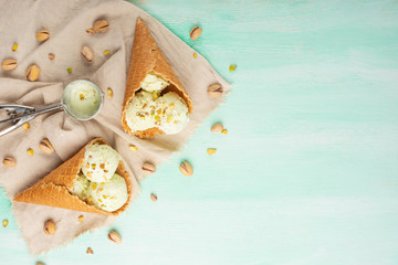 Ice cream with pistachios on a light background, with space. Summer mood