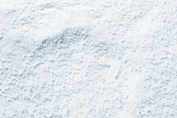 Fresh snow background texture. Winter background with snowflakes and snow mounds. Snow lumps.