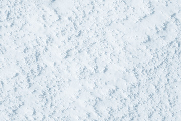 Fresh snow background texture. Winter background with snowflakes and snow mounds. Snow lumps.