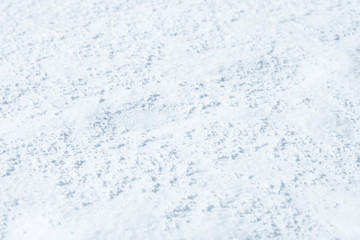 Fresh snow background texture. Winter background with snowflakes and snow mounds. Snow lumps.