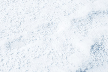 Fresh snow background texture. Winter background with snowflakes and snow mounds. Snow lumps.