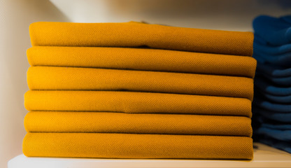 Stack of clothes on the store shelf