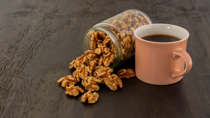 Enjoying a cup of coffee with walnuts