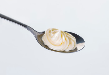 spoon with sauce isolated on white background