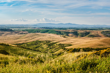 Fototapeta premium Tuscany landscape with hills, mountains and blue sky