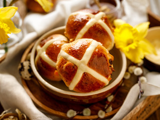 Hot cross buns, traditional ester hot cross buns in ceramic bowl, close up. Easter food