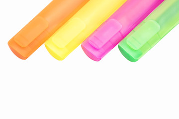 isolated yellow, orange, green and purple markers on the white background
