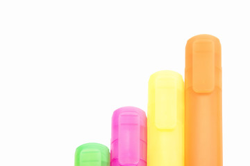 isolated yellow, orange, green and purple markers on the white background