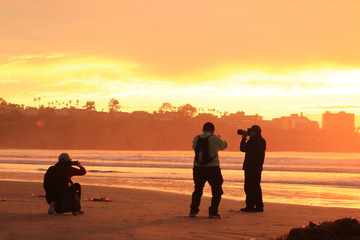 Photographer silhouette sunset beach 