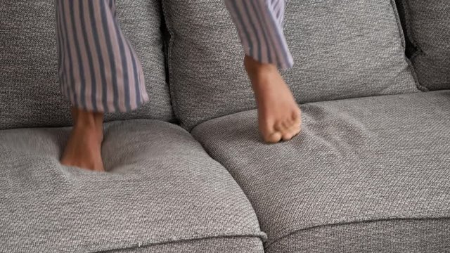 Feet Jumping On Sofa