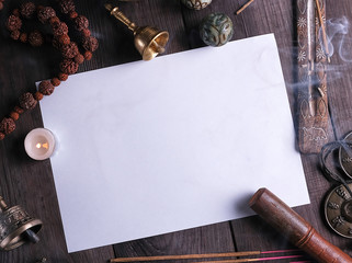 white sheet in the middle of religious objects for meditation