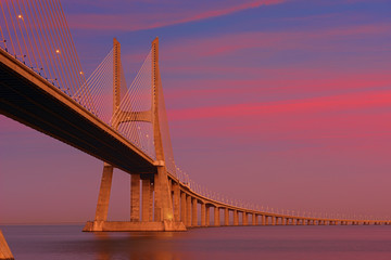 Vasco da Gama bridge at sunset .  Lisbon, Portugal.