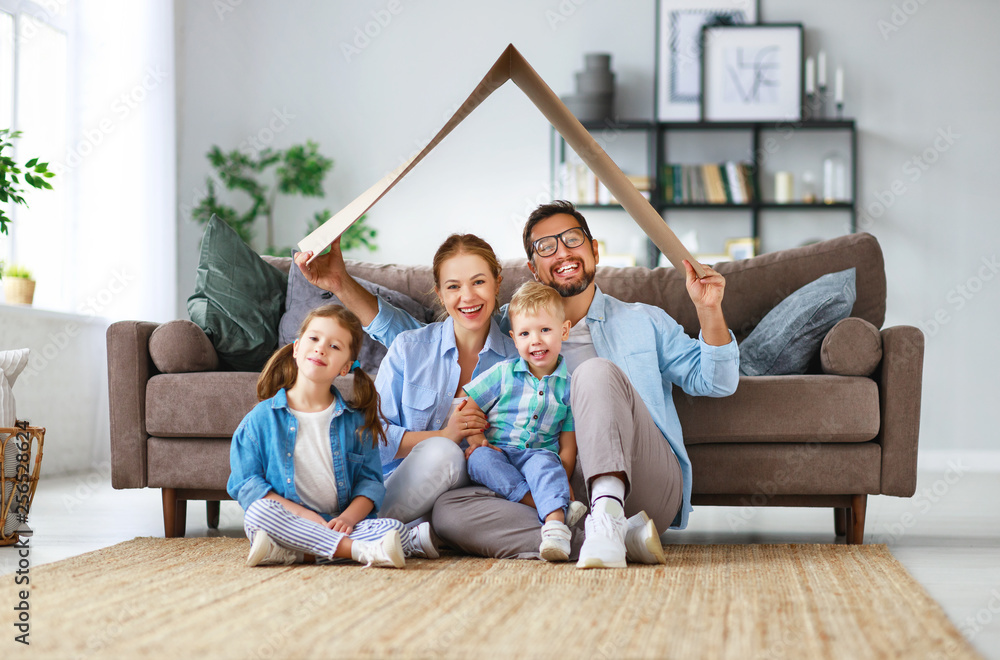 Canvas Prints concept of housing and relocation. happy family mother father and kids with roof at home .