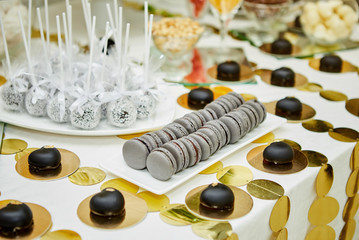 candy bar decorated by delicious sweet buffet with cupcakes and other desserts/candies,happy birthday concept