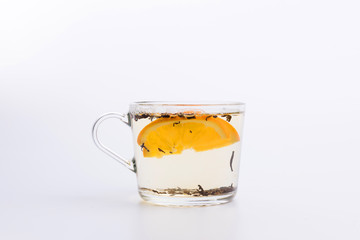 Glass cup of black tea with lemon. Isolated on white background