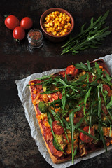 Vegan pizza with vegetables and sauce. Healthy fast food. Keto pizza. Square pizza.