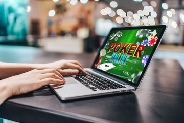 Girl using her laptop for playing poker online