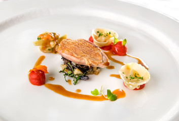 Quail fillet, olive, basil, red pepper puree and tortellini with artichoke.