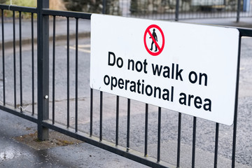 Do not walk on operational area at bus coach turning parking station
