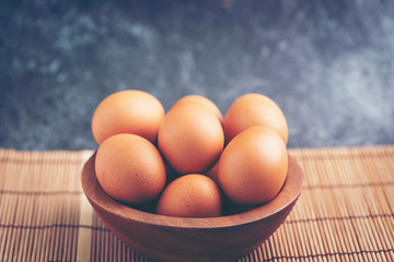 eggs in wooden bowls, dairy product for healthcare