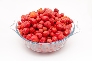 Fresh strawberry in a bowl isolated on white background