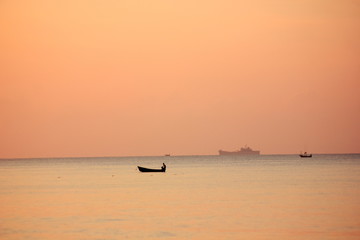 Fishing boats in the sea in the morning,Quiet sea without waves.Thailand
