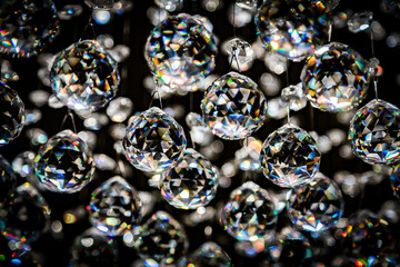 Abstract crystal chandelier pendant or crystal faceted balls background on black