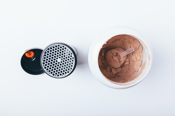 Open jar with chocolate protein powder