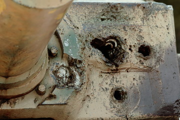 Old battle tank 2nd World War in the snow under the trees.