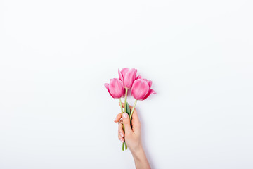 Woman's hand holding small bouquet